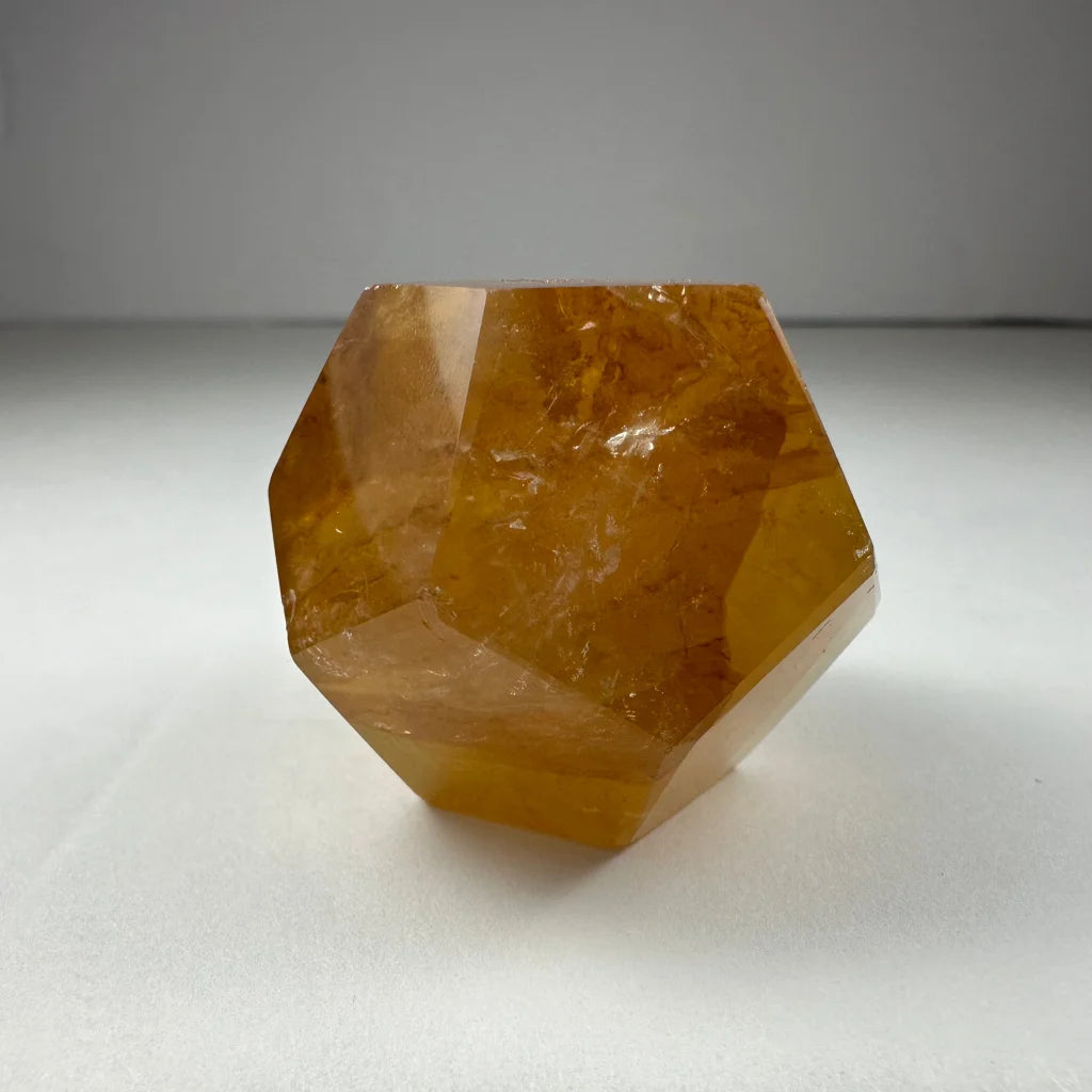 Stunning yellow hematoid quartz dodecahedron carving from Brazil