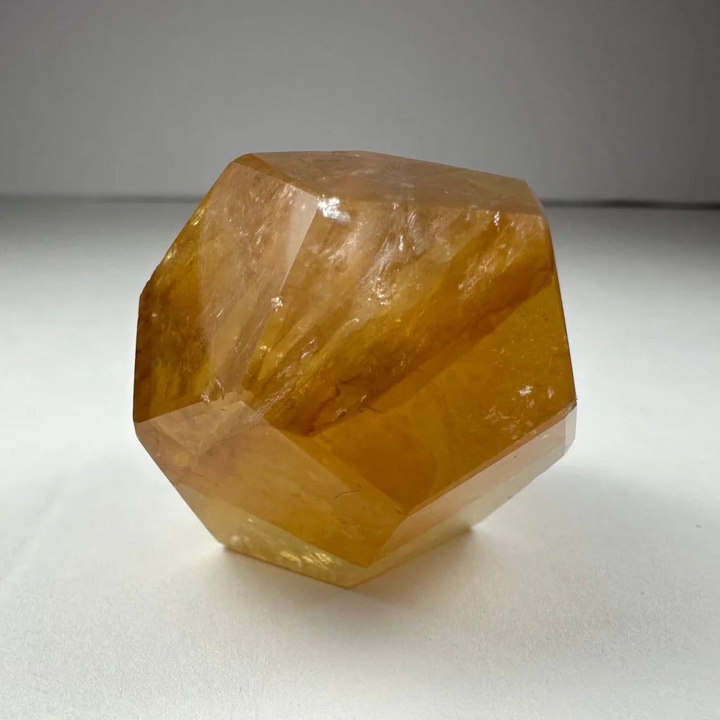 Stunning yellow hematoid quartz dodecahedron carving from Brazil