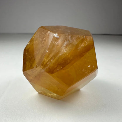 Stunning yellow hematoid quartz dodecahedron carving from Brazil