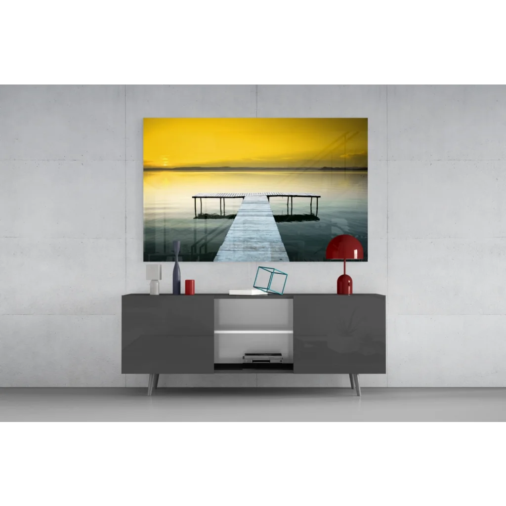 4K QLED TV in black frame with silver legs showing serene dock in Yellow Sky Pier glass wall art