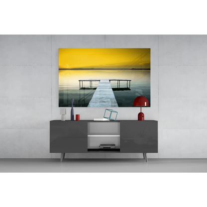 4K QLED TV in black frame with silver legs showing serene dock in Yellow Sky Pier glass wall art