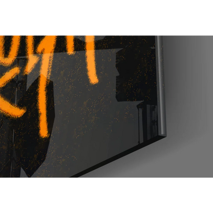 Sleek black-framed glass wall art with bold orange Basquiat graffiti