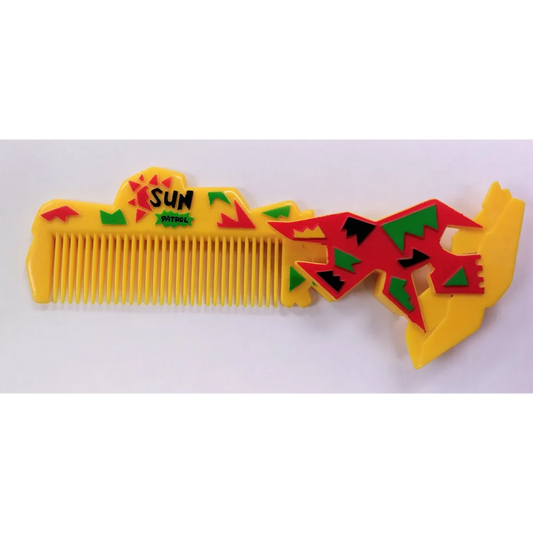 Yellow sun patrol comb with red green accents and sun handle design