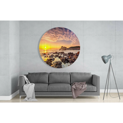 Vibrant sunset tempered glass art on rocky shore with pier
