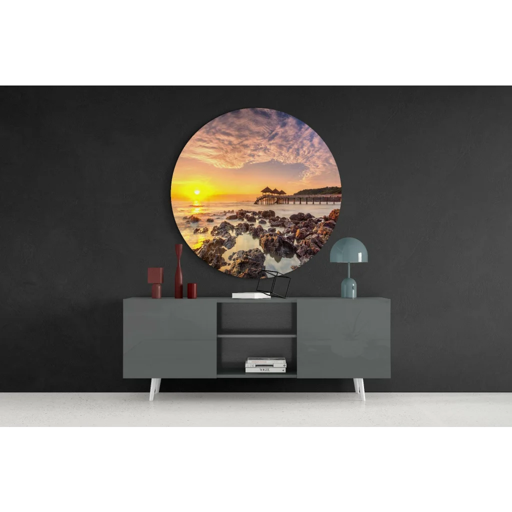 Vibrant sunset tempered glass art over rocky shoreline with pier