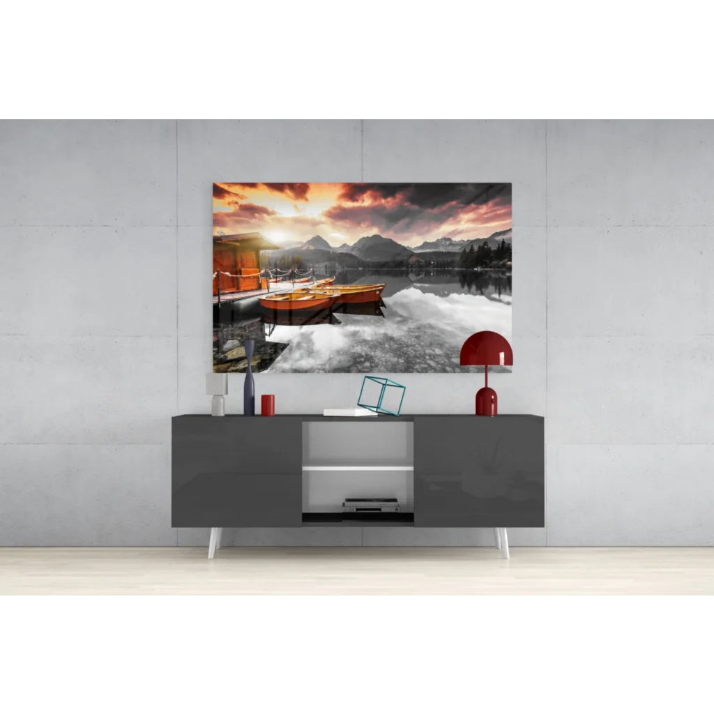 Serene sunset lake boats glass wall art with mountain views