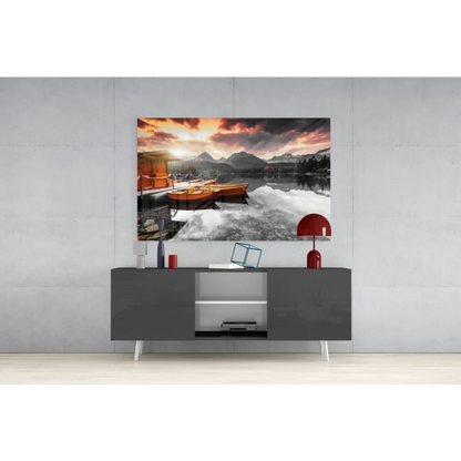 Serene sunset lake boats glass wall art with mountain views
