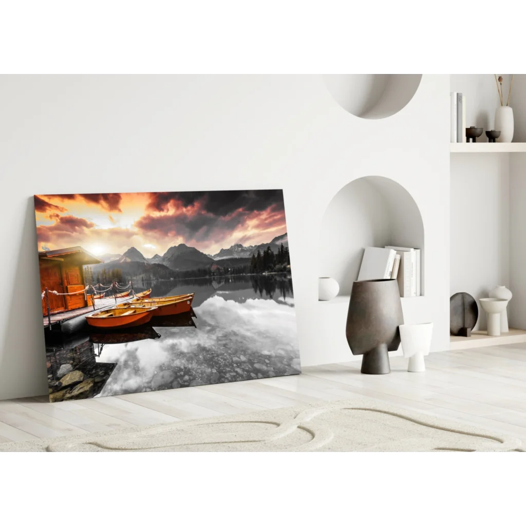 Vibrant sunset glass wall art with orange boats, misty mountains, reflective lake