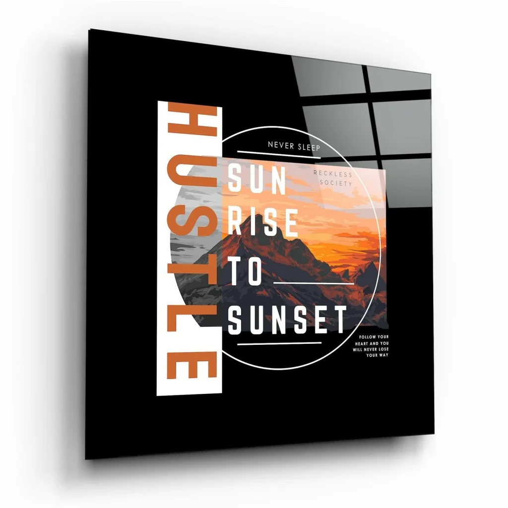 Black glass wall art of mountain sunrise with hustle sunrise to sunset text