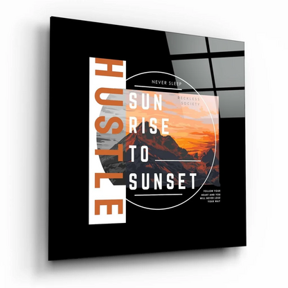 Black glass wall art of mountain sunrise with hustle sunrise to sunset text