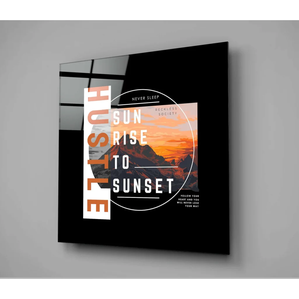 Black framed glass wall art with mountain sunset and bold typography