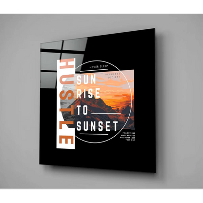 Black framed glass wall art with mountain sunset and bold typography