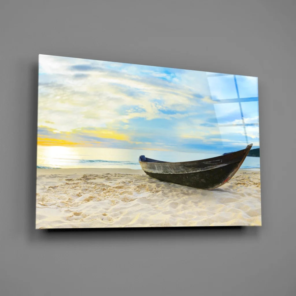Sleek black wooden boat on sandy beach at sunset, canvas wall art print
