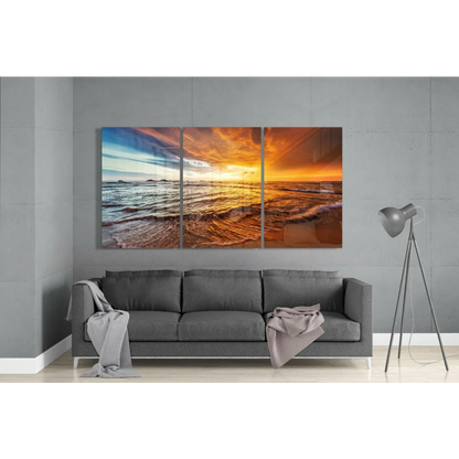 Vibrant sunset ocean glass wall art in fiery orange tones