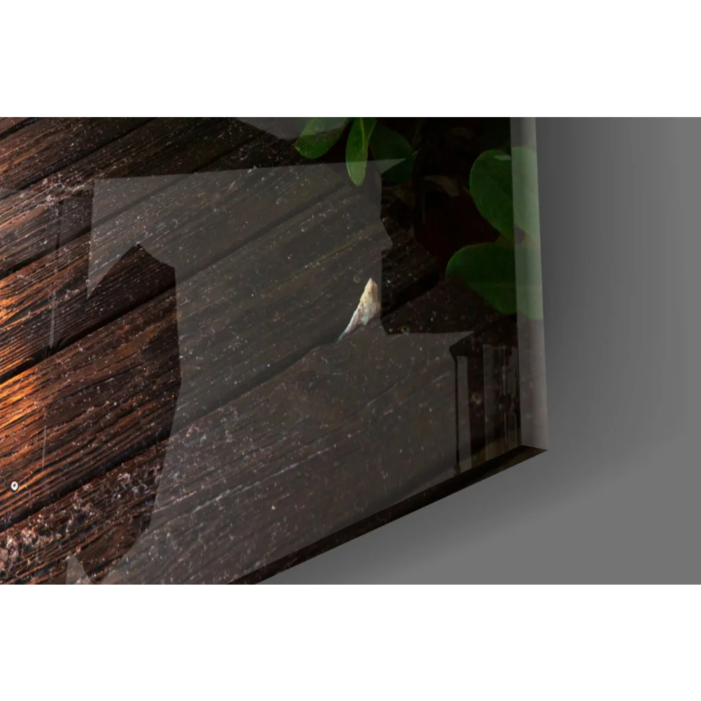 Sleek glass wall art with dark wood grain and green leaf accents