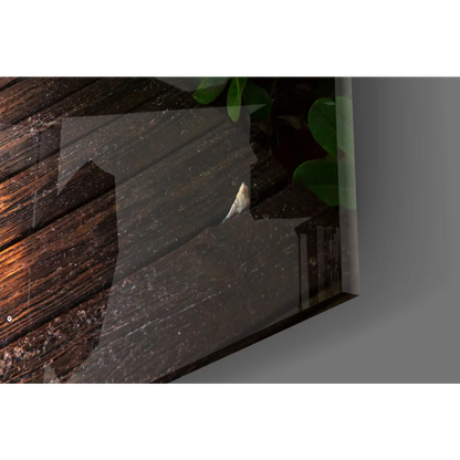 Sleek glass wall art with dark wood grain and green leaf accents