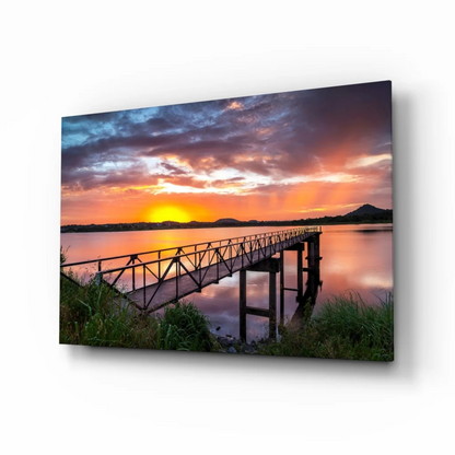 Vibrant sunset pier over tranquil waters on framed glass wall art