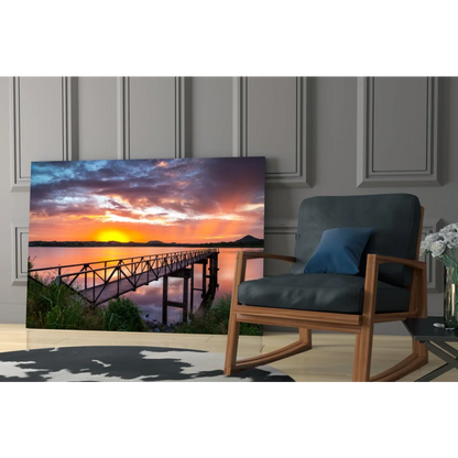 Vibrant sunset glass wall art of wooden pier over tranquil waters