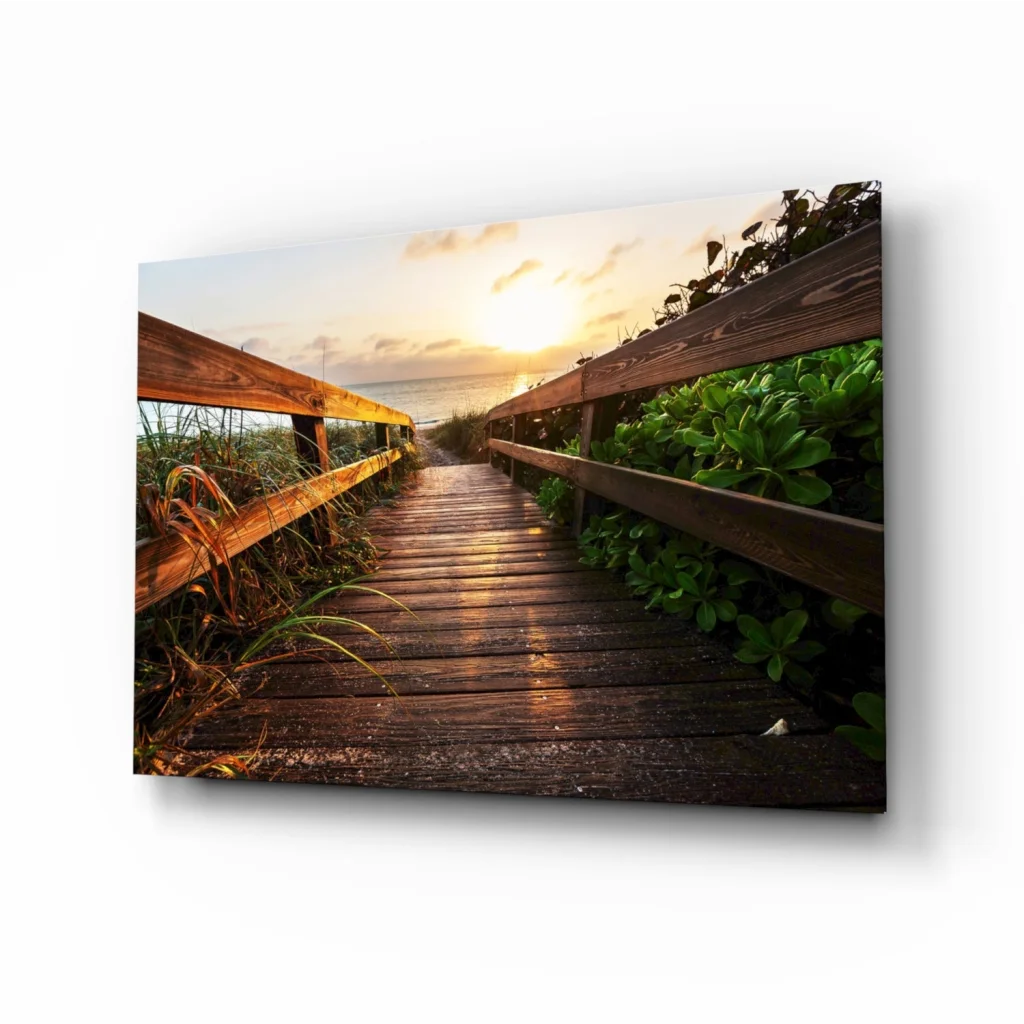 Sunset boardwalk wall art with golden glow and lush foliage