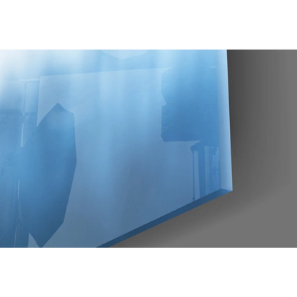 Translucent blue glass wall art with geometric patterns and sunset reflection