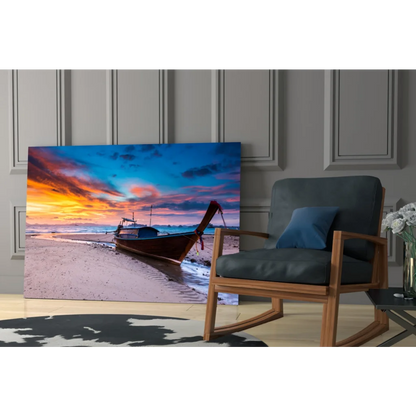 Vibrant sunset longtail boat canvas wall art on sandy beach