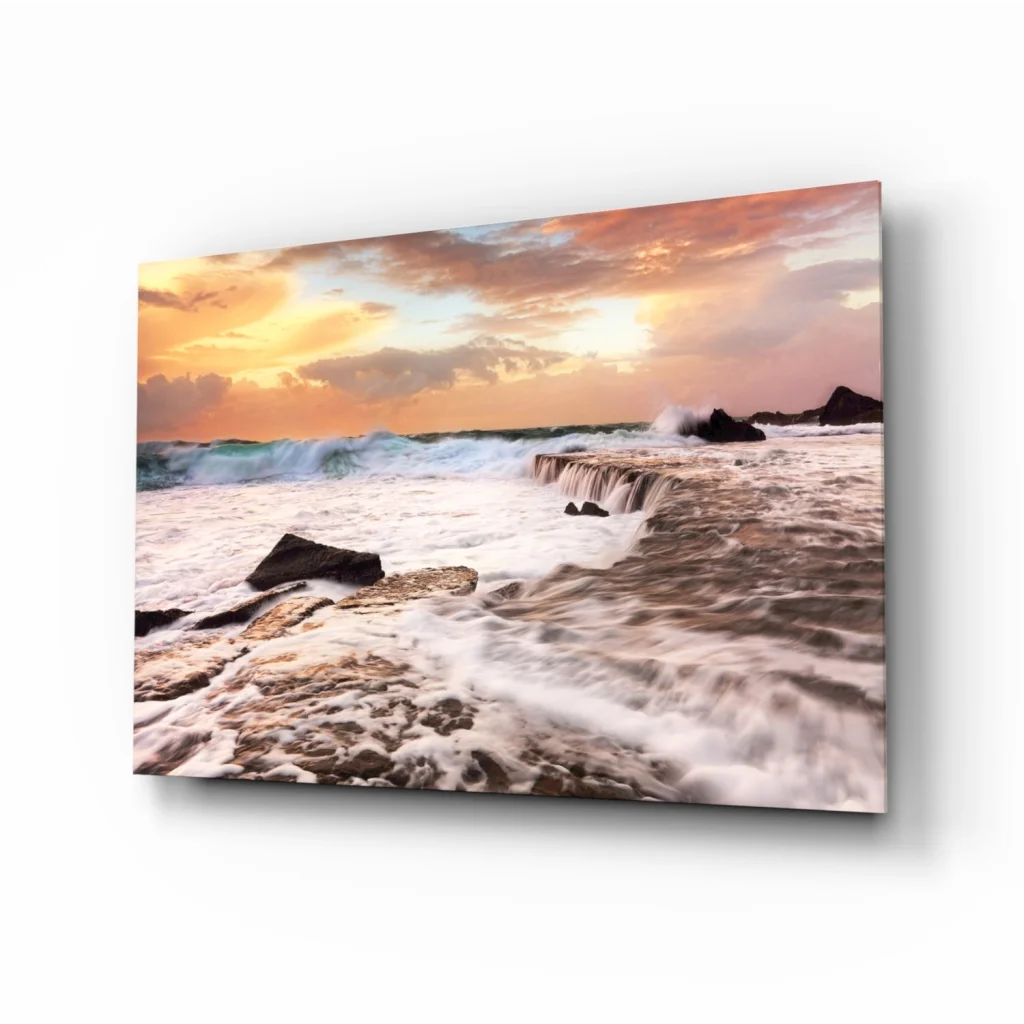 Sunset waves crashing on rocks canvas wall art in warm hues
