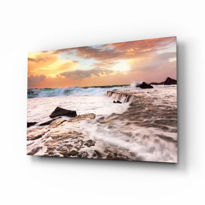 Sunset waves crashing on rocks canvas wall art in warm hues