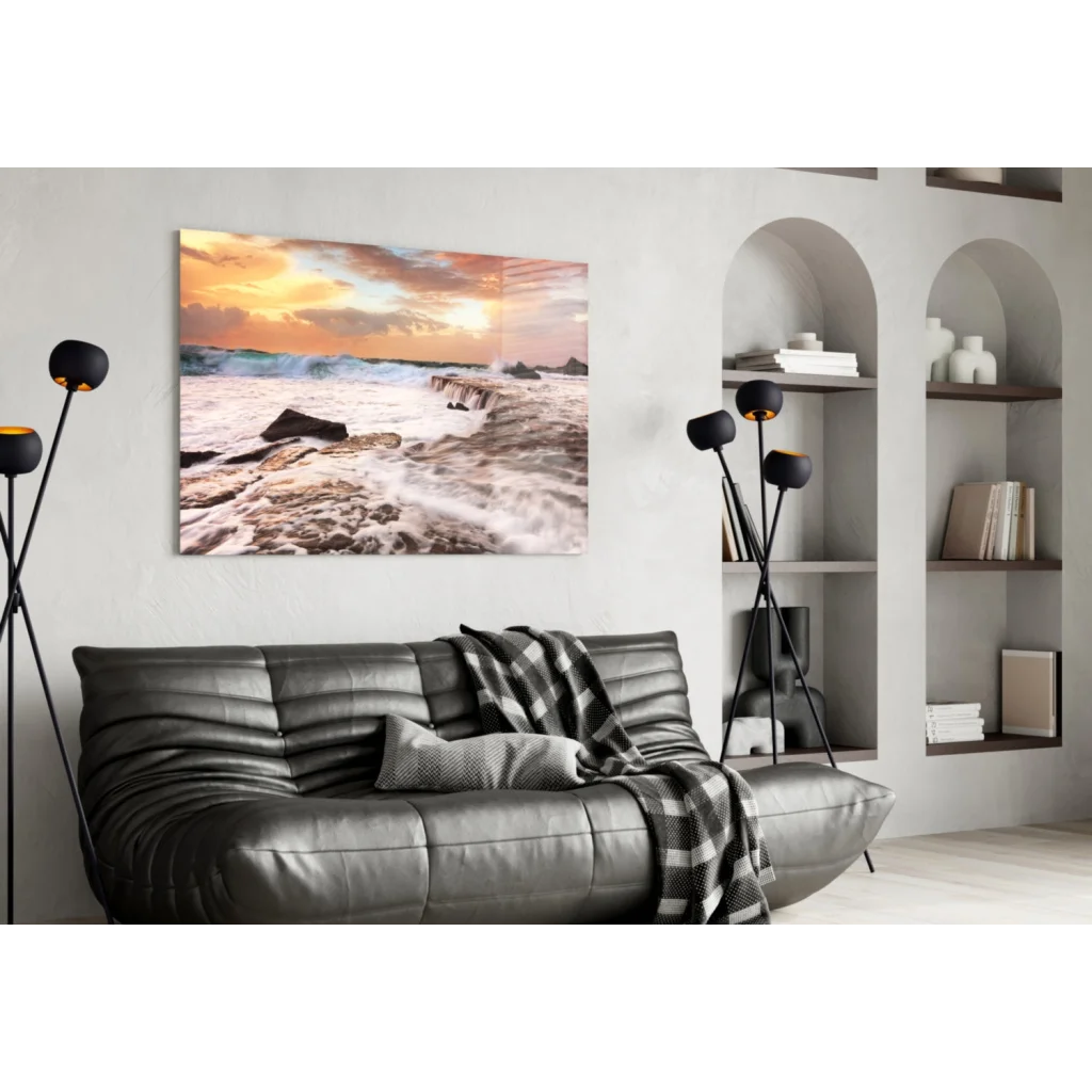 Leather sofa with checkered blanket under Sunset Beach Waves wall art