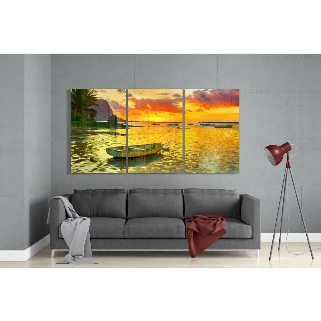 Vibrant sunset seascape glass wall art triptych with green boat