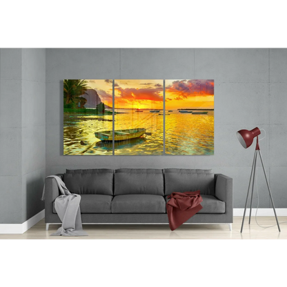 Vibrant sunset seascape glass wall art triptych with green boat