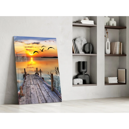 Serene sunset over lake with flying birds on Sunset Pier glass wall art