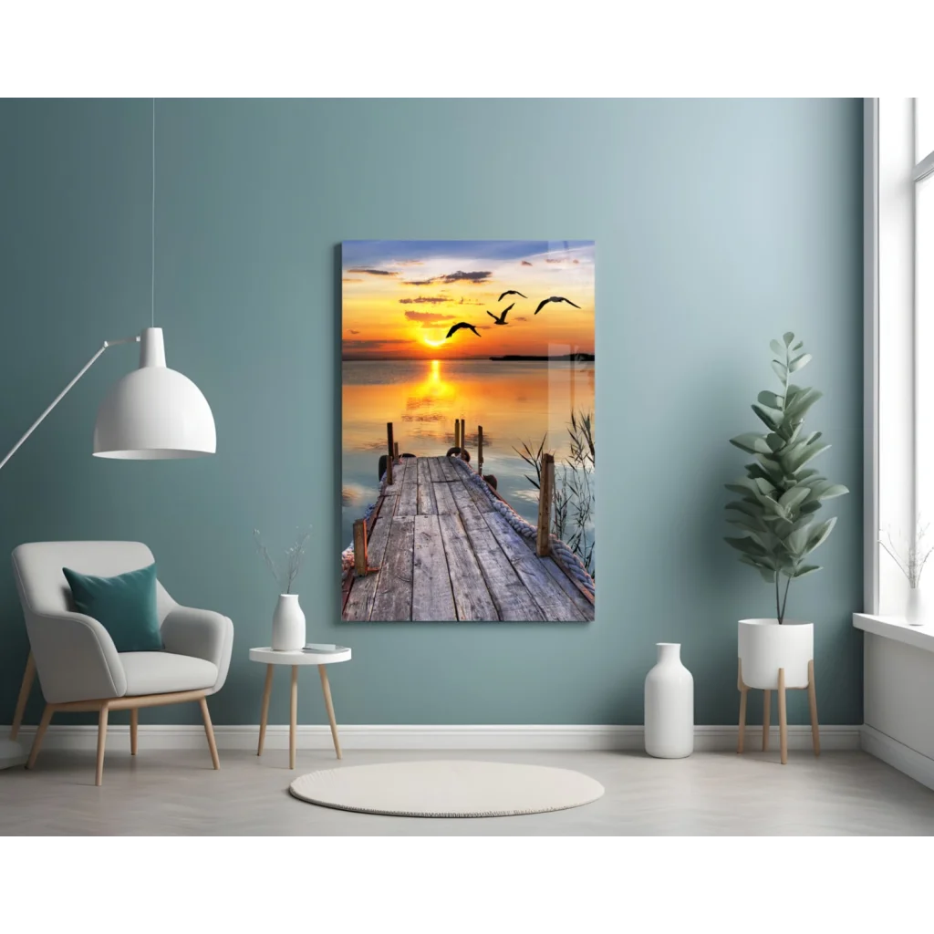 Sunset pier glass wall art with flying birds over dock at dusk