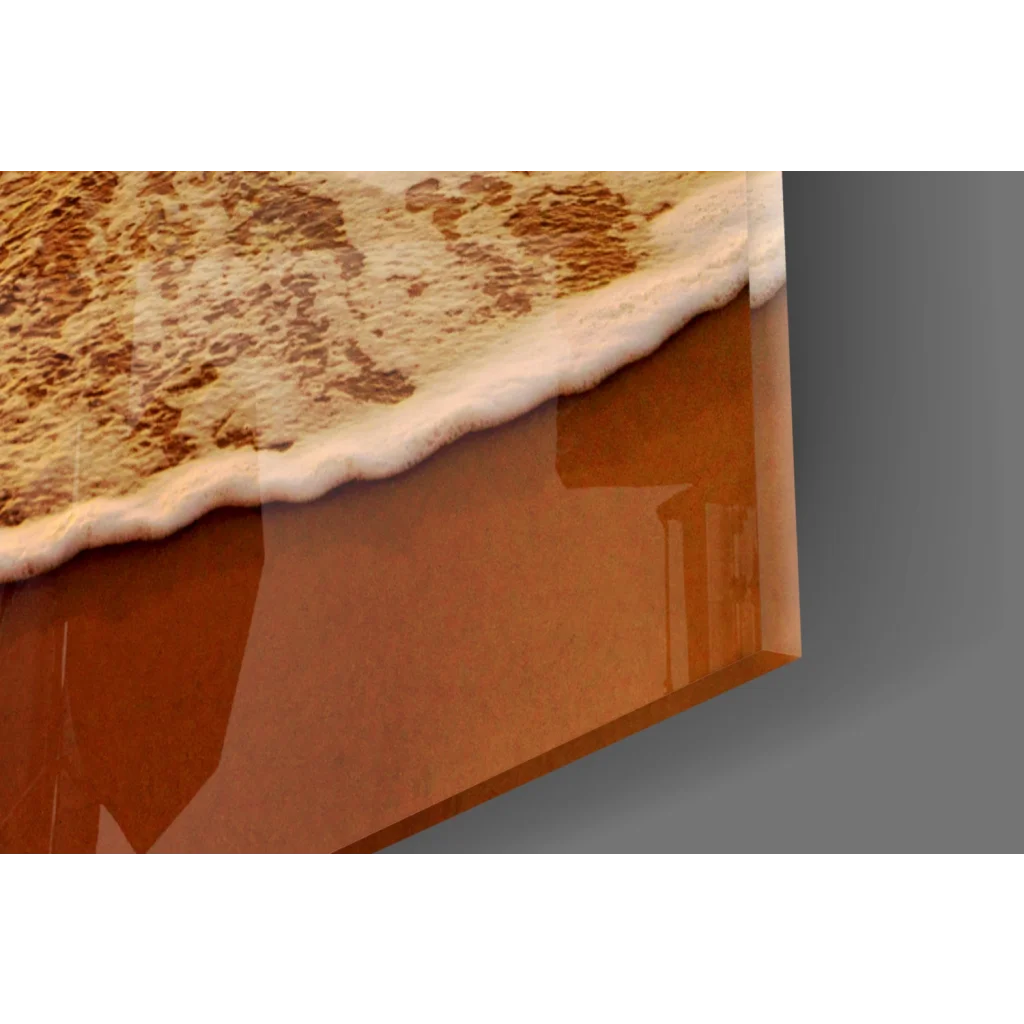 Glossy amber glass wall art of ocean waves cresting in sunset hues