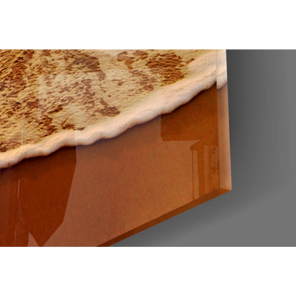 Glossy amber glass wall art of ocean waves cresting in sunset hues