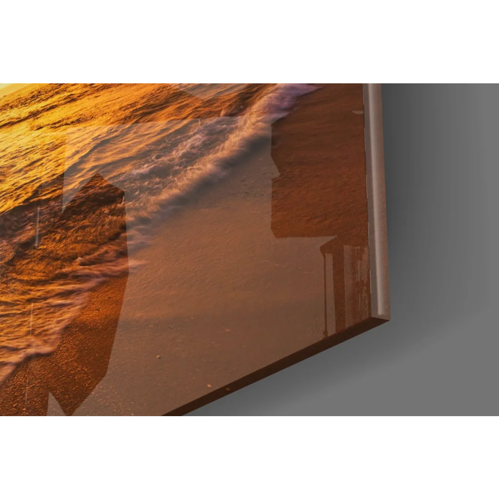 Vibrant sunset ocean glass wall art panel with golden waves on shore