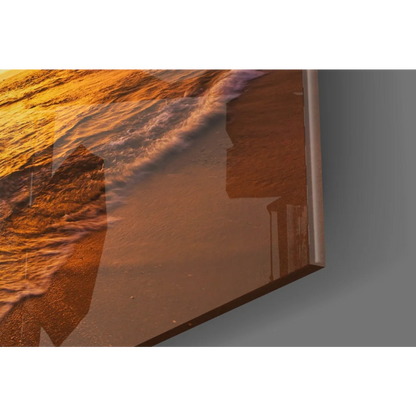 Vibrant sunset ocean glass wall art panel with golden waves on shore