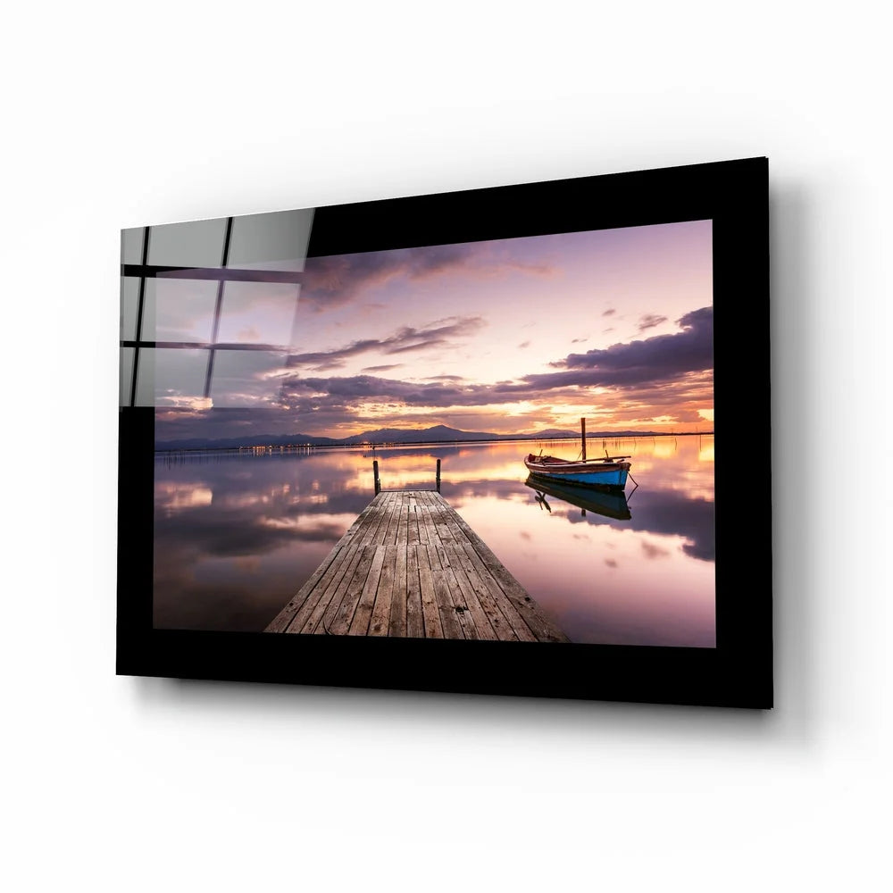 Stunning sunset glass wall art with blue boat and dock