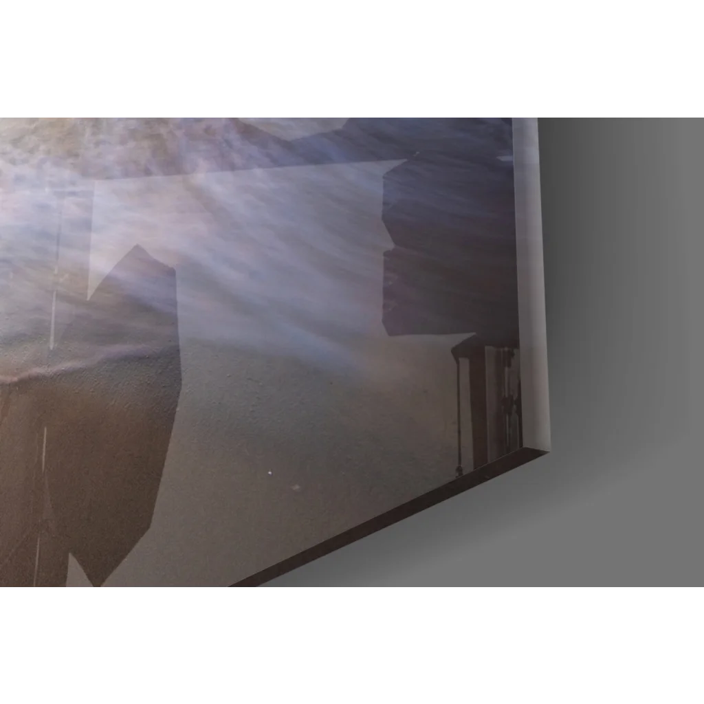 Misty mountainous glass wall art with sunset haze