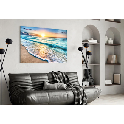Beige turquoise beach sunset glass wall art above gray leather sofa