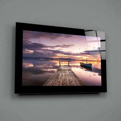 Stunning sunset glass wall art with blue boat and dock