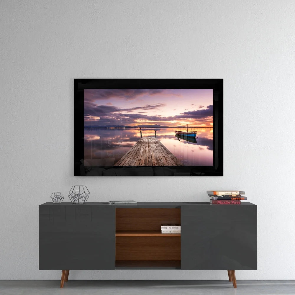 Stunning sunset glass wall art with blue boat and dock