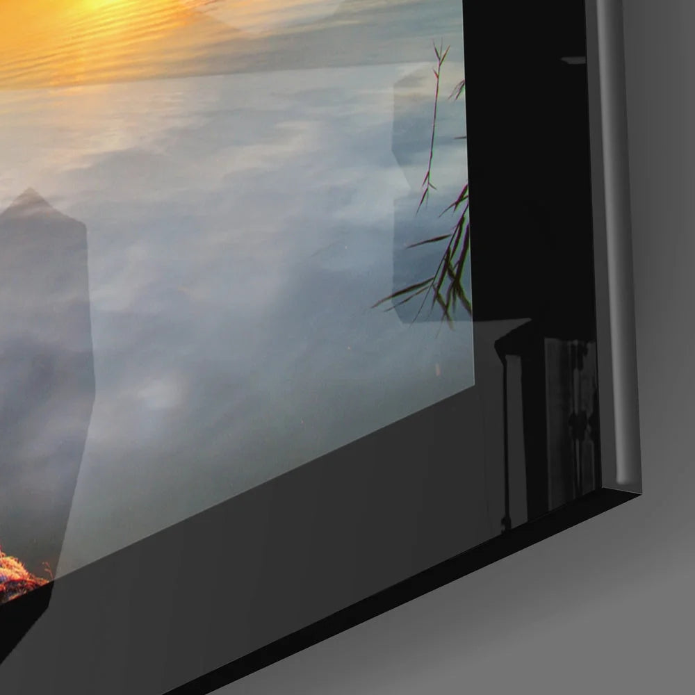 Sleek misty mountain sunrise glass wall art with golden water reflections