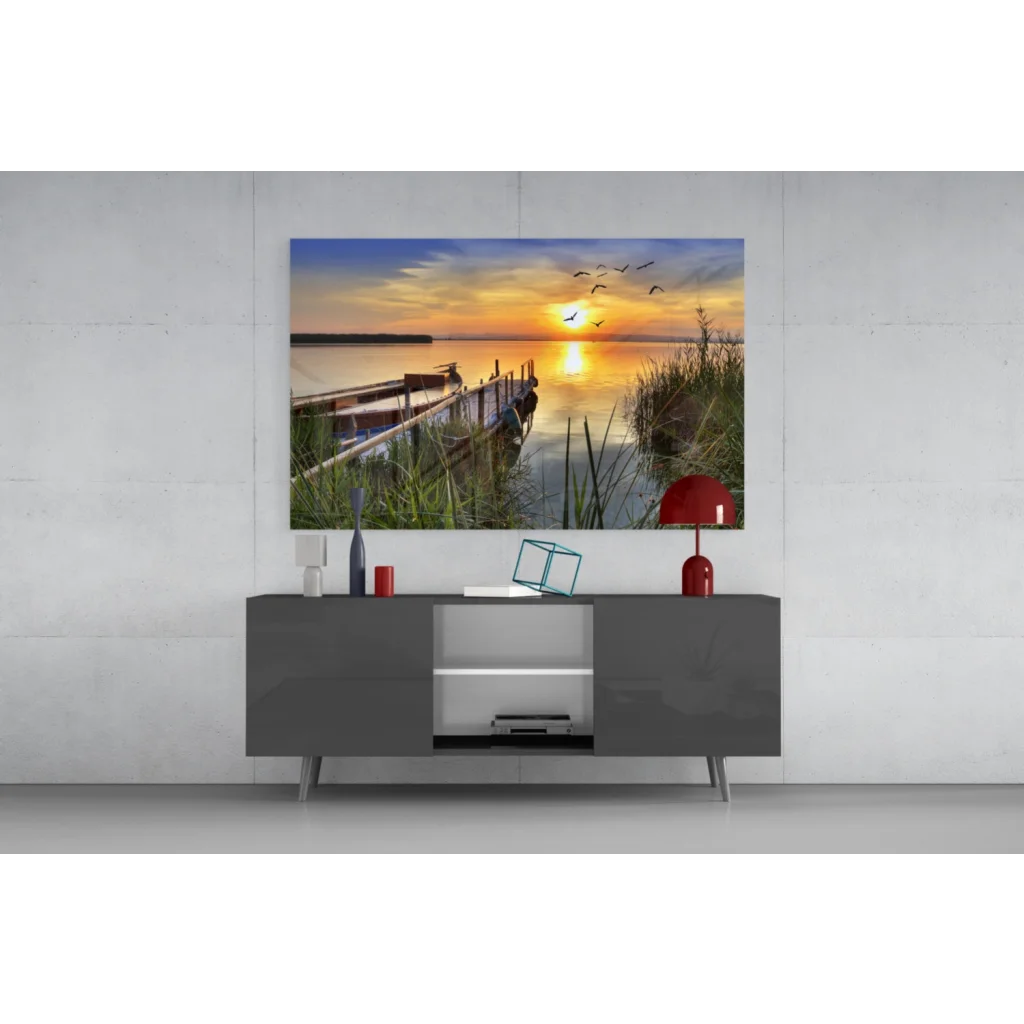 Vibrant sunset glass wall art with dock, birds, and reeds
