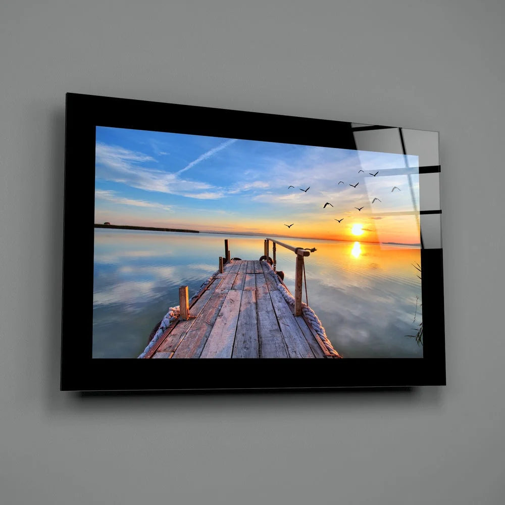 Serene dock sunset glass wall art with golden reflections and birds