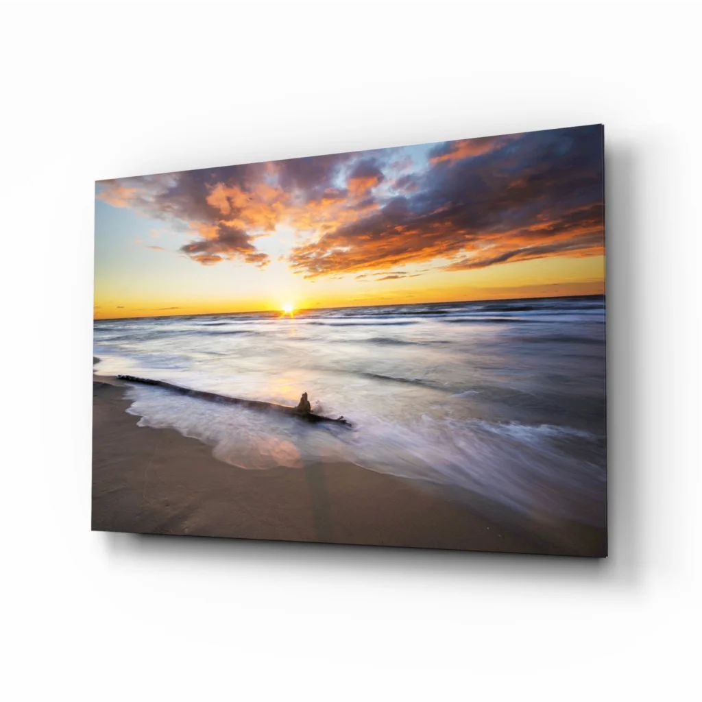 Serene sunset beach glass wall art with orange purple clouds over calm ocean waves