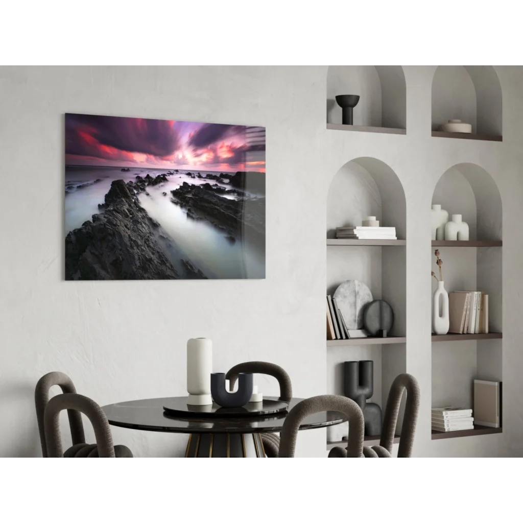 Vibrant purple pink sunset over rocky coast glass wall art print