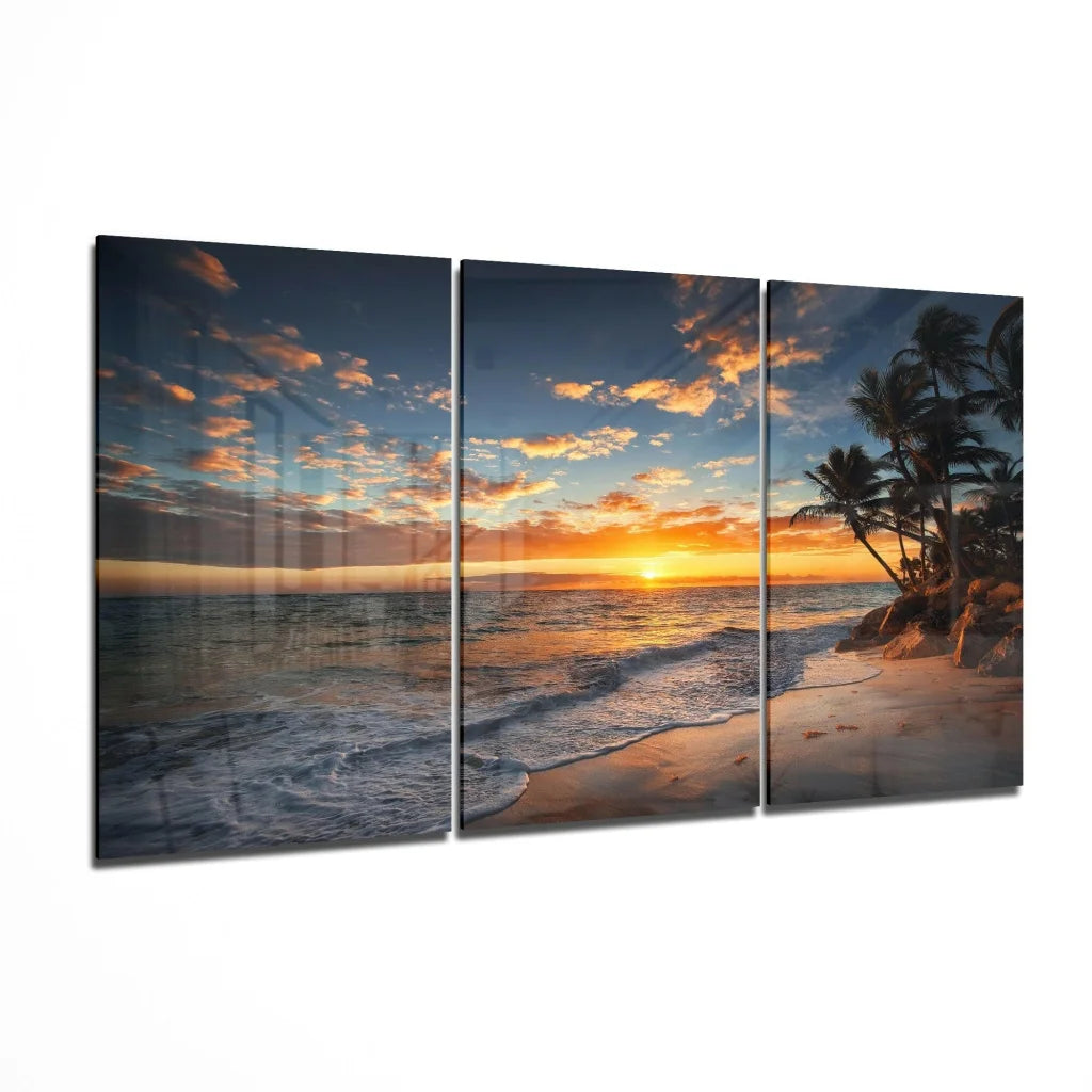 Stunning sunset beach triptych wall art with palm trees in warm orange hues