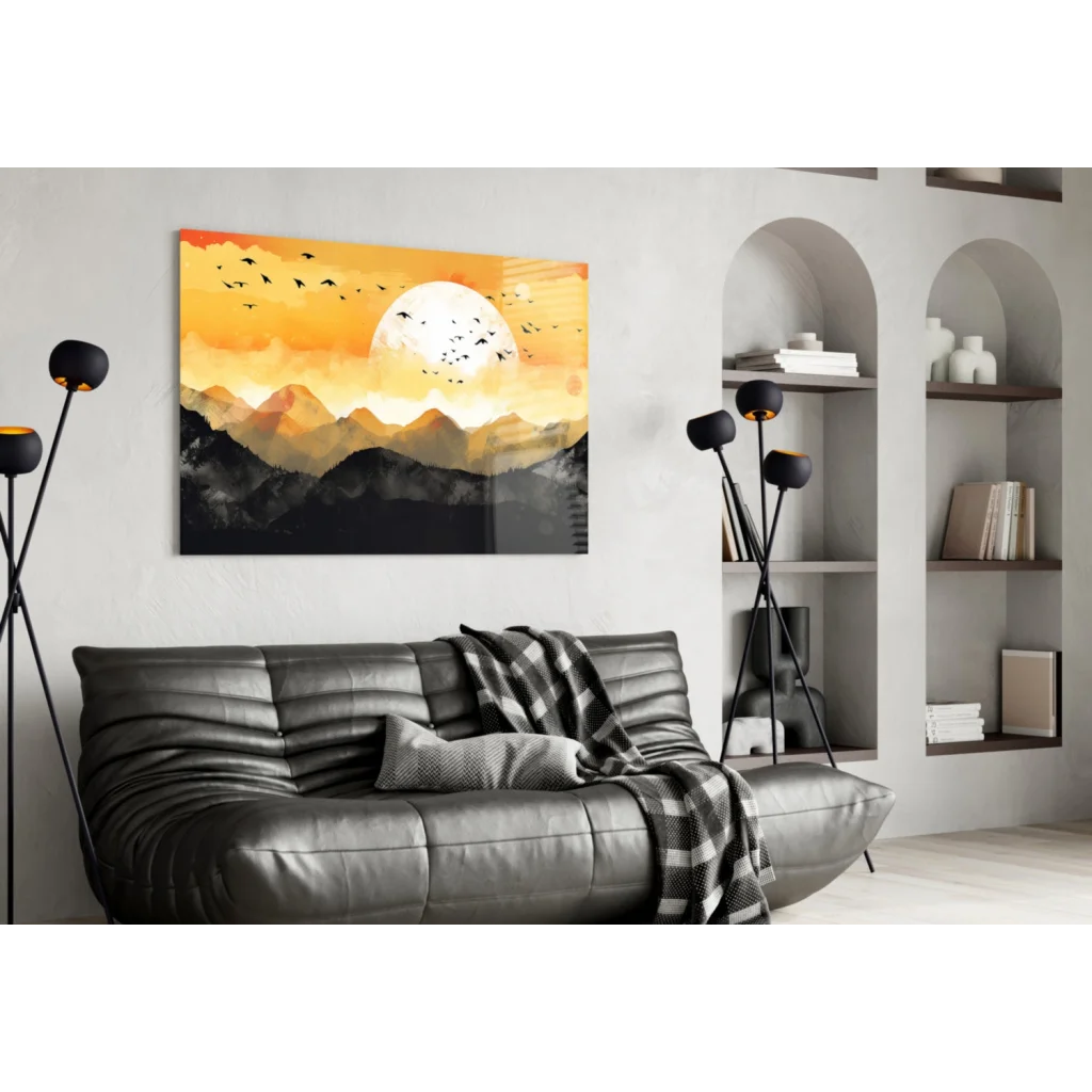 Modern black leather sofa with tufted cushions and plaid throw under Sunset Mountain wall art