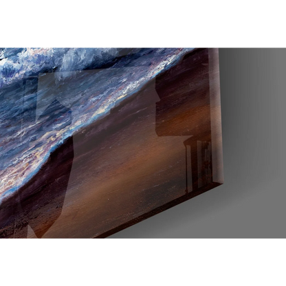 Sunset ocean waves glass wall art with sailboat in blues and browns