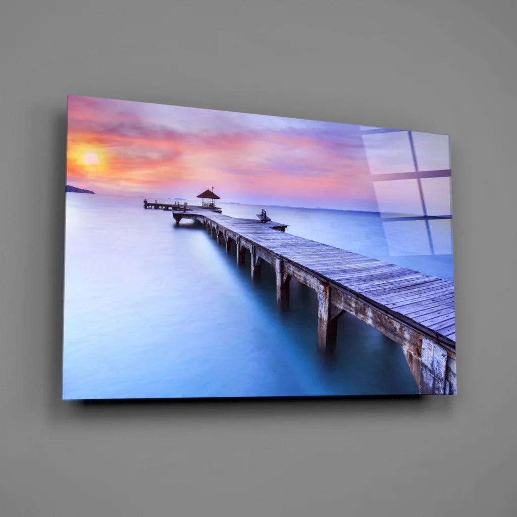 Serene sunset pier canvas wall art with vibrant pink orange sky hues
